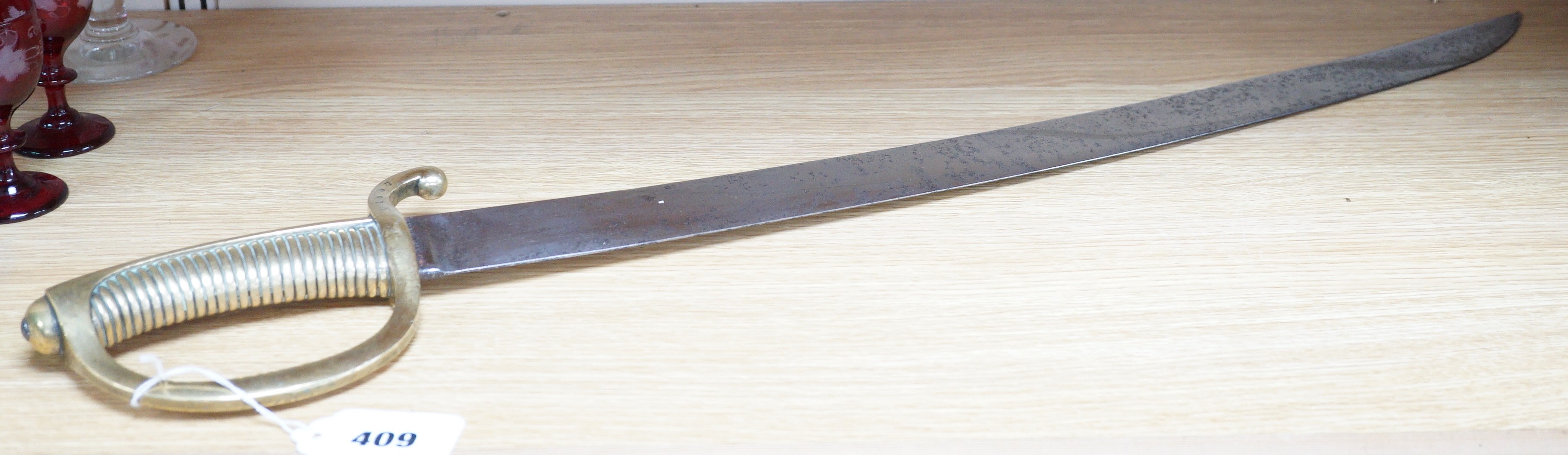 An early 19th century French sabre, the blade stamped HENRAUX, 73cm long